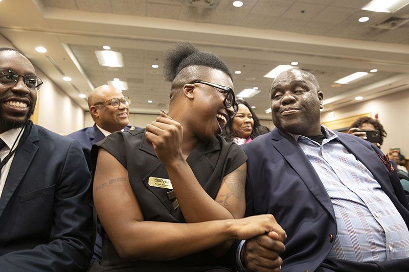 Runner-up Tre'Vell Anderson (left) and president-elect Ken Lemon (right) shake hands after election results are announced.