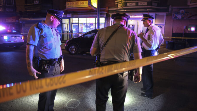 SHOOTING06-A Officers at a crime scene