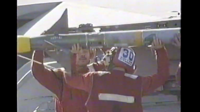 Screen Shot 2021-08-19 at 12.38.40 PM Sailors load bombs onto an aircraft aboard the USS Theodore Roosevelt during the invasion of Afghanistan in 2002.
