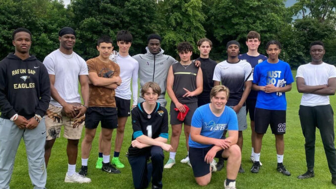 NIL-001 Timi Oke (Pictured in the Middle) surrounded by his Camp attendees, in South London, U.K. June 1st, 2024. Photo Courtesy of Timi Oke