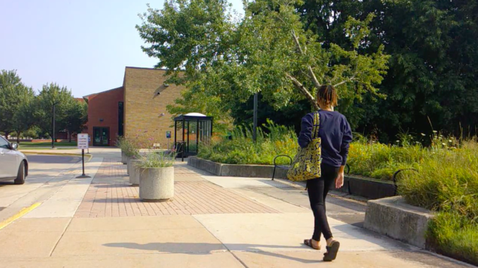 College student walks on campus.