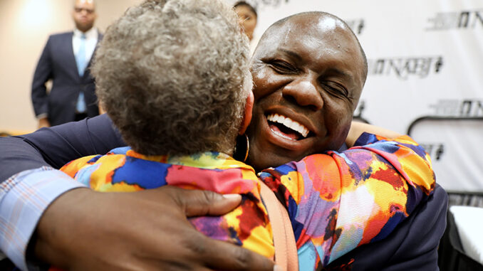 Ken Lemon embraces a supporter after being elected as the 23rd president of NABJ. (Photo by Edi H. Doh)