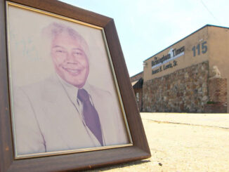 Framed photo of Dr. Jesse Lewis outside of the Birmingham Times headquarters on Aug. 1, 2023