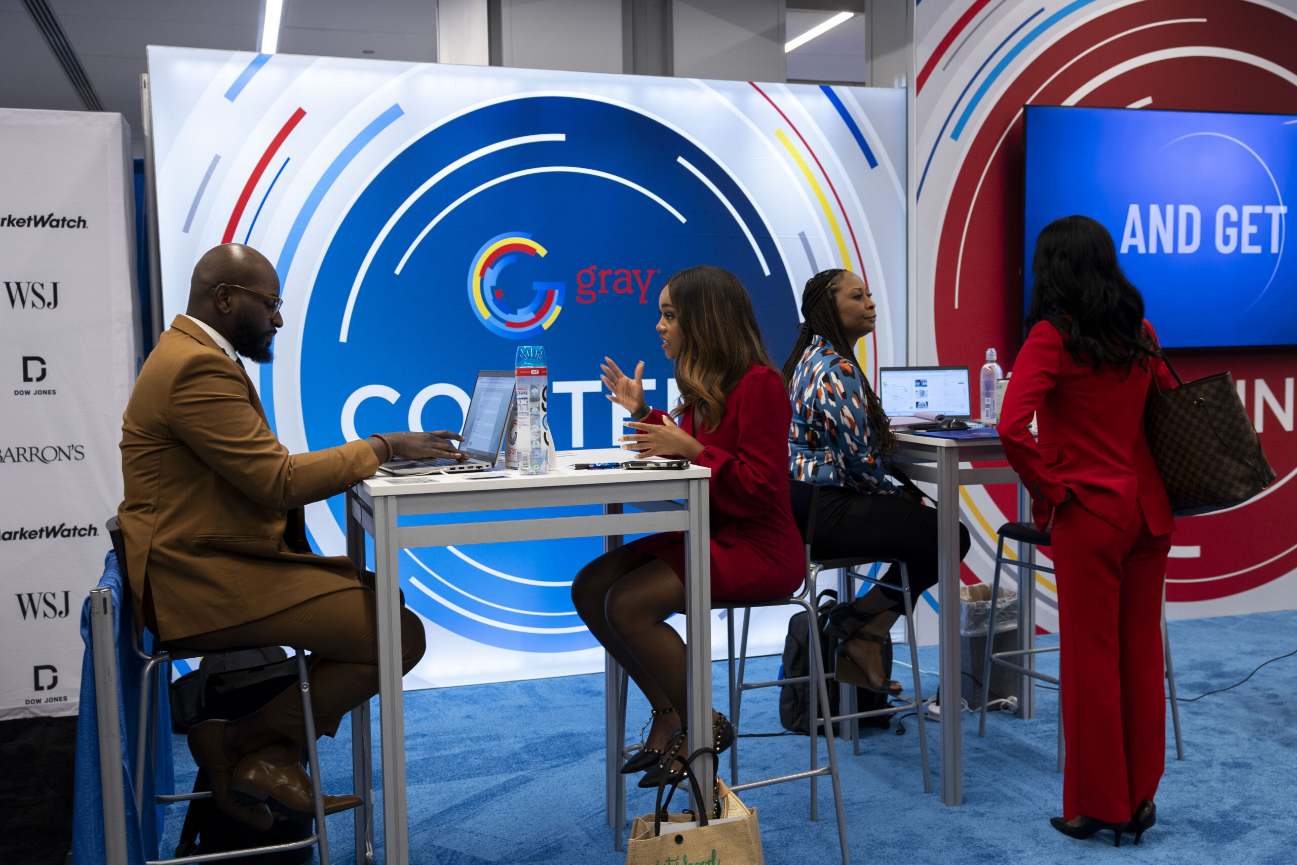 Convention attendees interact at the Gray TV booth at the NABJ 2024 Convention & Career Fair at the Hilton Chicago in Chicago, Ilinois on Aug. 1, 2024. (Eleazar Yisrael/NABJ Monitor)